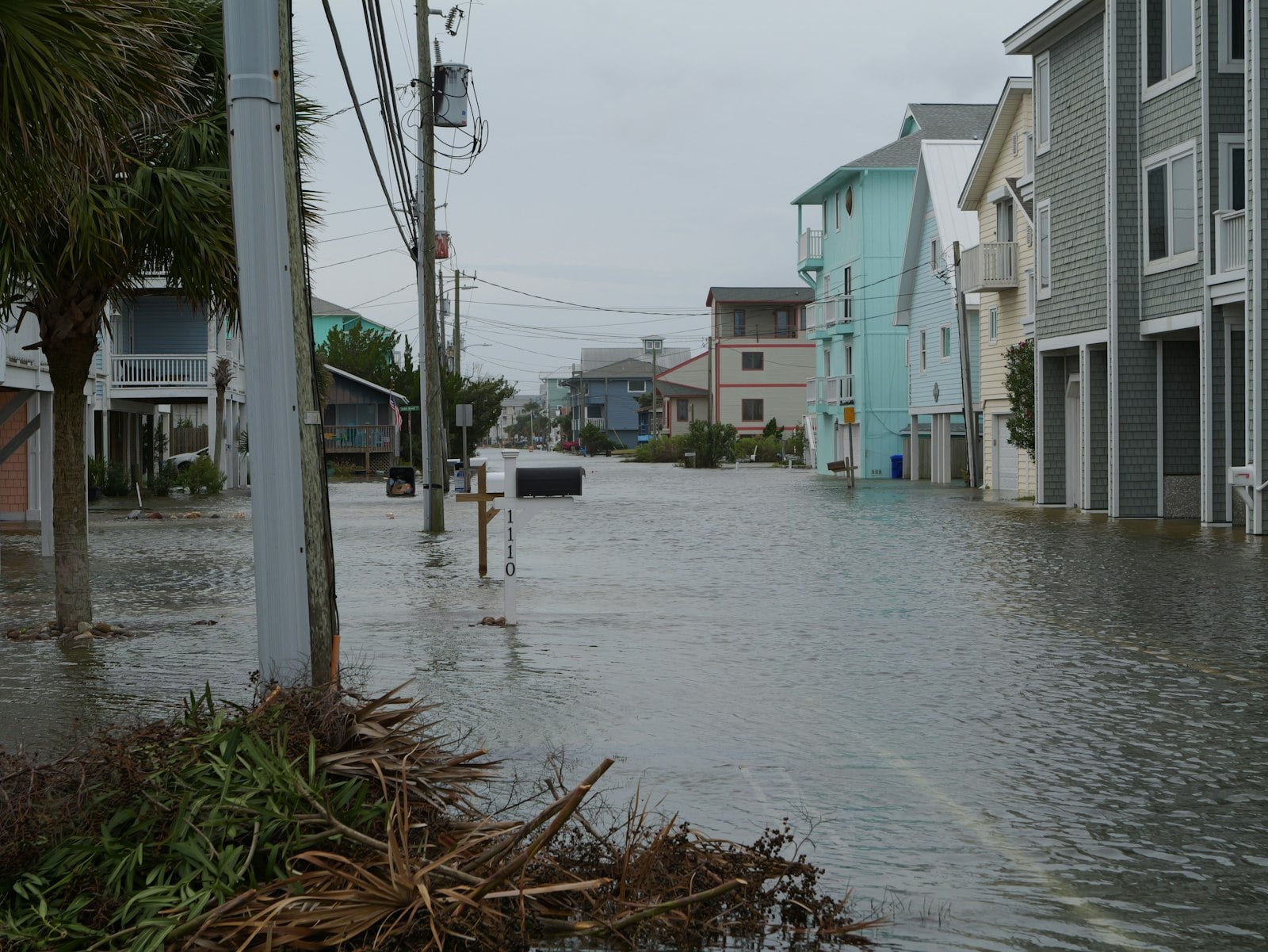 Street flooded with water and debris after a storm
